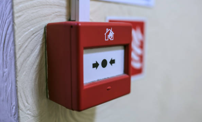 Compartment Fire Evacuation Drills - Red manual fire alarm call point on wall - Phoenix STS Ireland