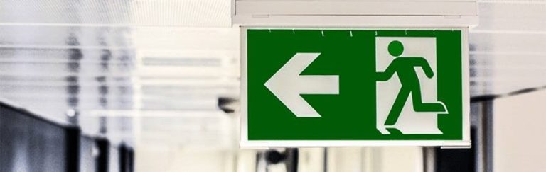 Evacuation planning - staff evacuating building during supervised fire drill in Ireland