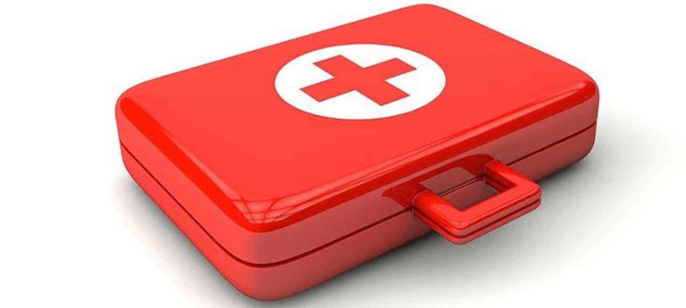 Red first aid kit with white cross symbol representing the First Aid Course from Phoenix STS Ireland