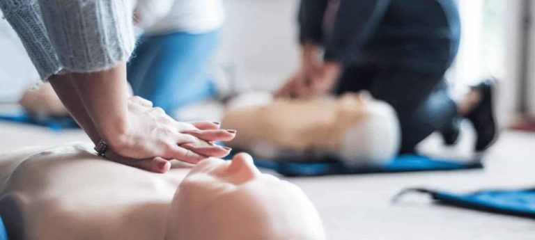 Participants practising CPR chest compressions on training manikins during a HeartSaver CPR Course from Phoenix STS Ireland