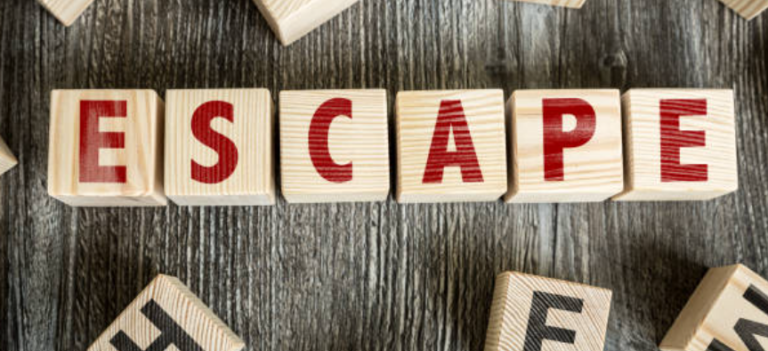 Evacuation plan drawings - wooden letter blocks spelling ESCAPE representing emergency escape route planning